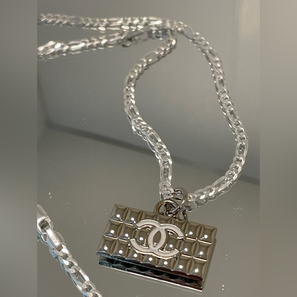 AUTHENTIC Chanel charm strung on brand new solid sterling silver chain